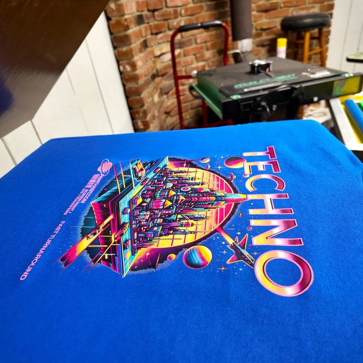 Picture of custom dtf printed shirt on heat press