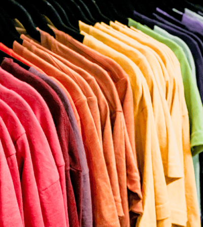 Picture of blank t-shirts on a rack waiting for custom dtf printing